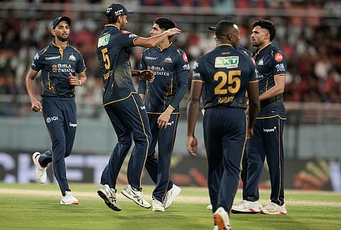 Gujarat Titans' Ashok Sharma, right, celebrates with teammates the wicket of Punjab Kings' Marco Jansen during the Indian Premier League cricket match between Gujarat Titans and Punjab Kings in New Chandigarh.