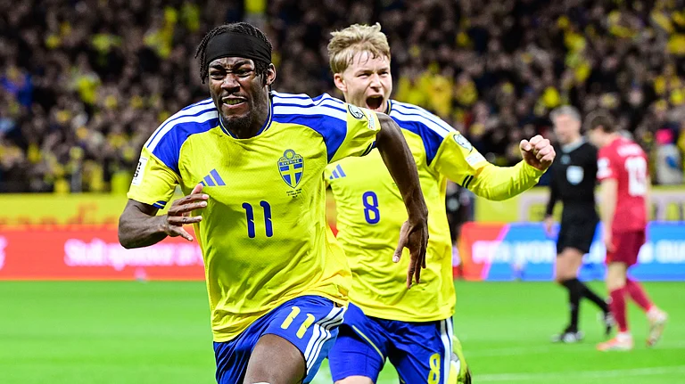 Sweden's Anthony Elanga, front, celebrates with Daniel Svensson after scoring during a World Cup qualifying playoff final soccer match between Sweden and Poland in Stockholm, Tuesday, March 31, 2026. - (Jonas Ekstromer/TT via AP)