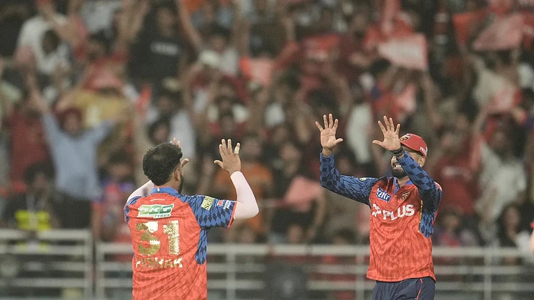 Punjab Kings' Vijaykumar Vyshak celebrates with captain Shreyas Iyer, right, the wicket of Gujarat Titans' Glenn Phillips during the Indian Premier League cricket match between Gujarat Titans and Punjab Kings in New Chandigarh, India, Tuesday, March 31, 2026. - AP Photo