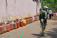 Day In Pics: March 31, 2026 | Photo: PTI : A security personnel stands guard as empty LPG cylinders are arranged in a line amid an ongoing supply crisis, in Ranchi, Jharkhand.