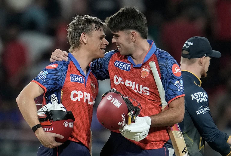 Punjab Kings' Cooper Connolly, left, and Xavier Bartlett celebrates the win against Gujarat Titans during the Indian Premier League cricket match in New Chandigarh. - | Photo: AP/Ashwini Bhatia