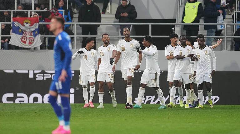 Saudi Arabia's team players celebrate after Abdullah Alhamddan, covered, scored the opening goal during the international friendly soccer match between Serbia and Saudi Arabia in Backa Topola, Serbia, Tuesday, March 31, 2026. - | Photo: AP/Darko Vojinovic