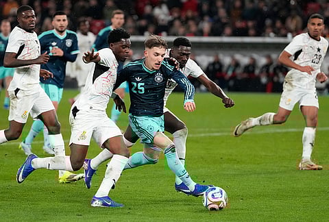 Lennart Karl of Germany and Derrick Kohn of Ghana challenge for the ball during an international friendly soccer match between Germany and Ghana in Stuttgart, Germany.
