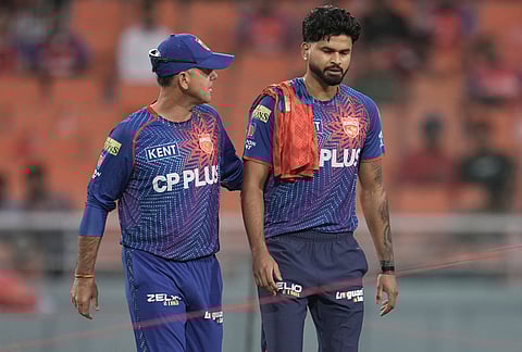 Punjab Kings head coach Ricky Ponting chats with captain Shreyas Iyer, right, during a warm-up session ahead of their Indian Premier League clash against Gujarat Titans in New Chandigarh.