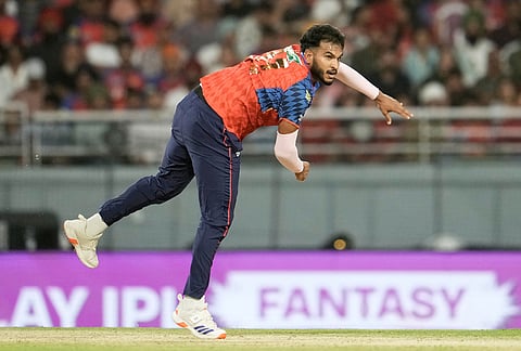 Punjab Kings' Vyshak Vijaykumar bowls a delivery during the Indian Premier League cricket match between Gujarat Titans and Punjab Kings in New Chandigarh.