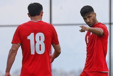 Iran's Mohammad Mohebi, right, celebrates after scoring his side's third goal during a friendly soccer match between Iran and Costa Rica, in Antalya, southern Turkey.