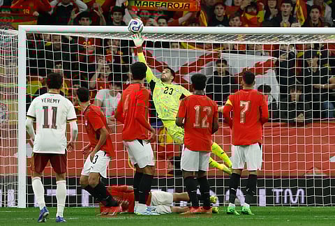 Egypt's goalkeeper Mostafa Shobeir saves during the international friendly soccer match between Spain and Egypt in Barcelona, Spain.