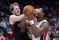 | Photo: AP/Duane Burleson : Detroit Pistons center Jalen Duren (0) is fouled by Toronto Raptors center Jakob Poeltl (19) while going to the basket during the second half of an NBA basketball game in Detroit. 