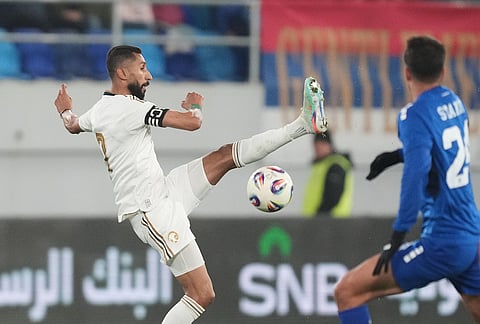 Saudi Arabia's Salman Al Faraj, left, and Serbia's Petar Stanic challenge for the ball during the international friendly soccer match between Serbia and Saudi Arabia in Backa Topola, Serbia.