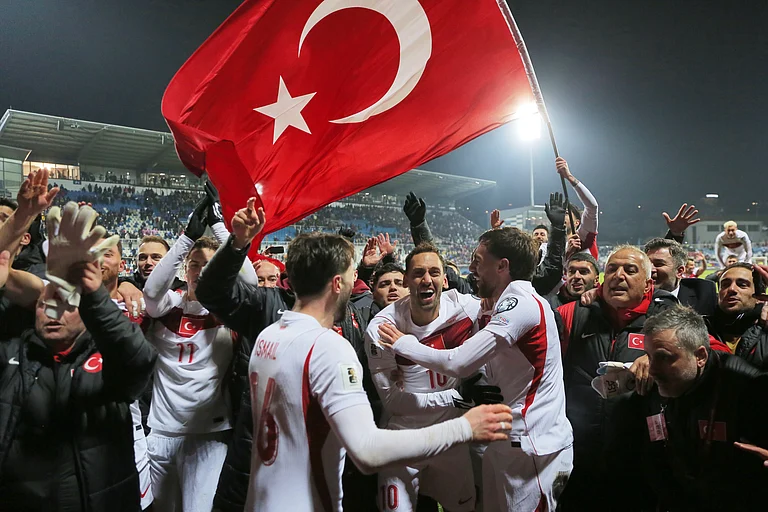 Turkey's players celebrate after winning the World Cup qualifying playoff final soccer match between Kosovo and Turkey in Pristina, Kosovo. - AP/Visar Kryeziu