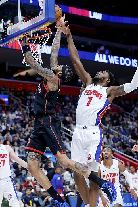 Toronto Raptors forward Brandon Ingram, left, goes to the basket past Detroit Pistons forward Paul Reed (7) during the first half of an NBA basketball game in Detroit. 