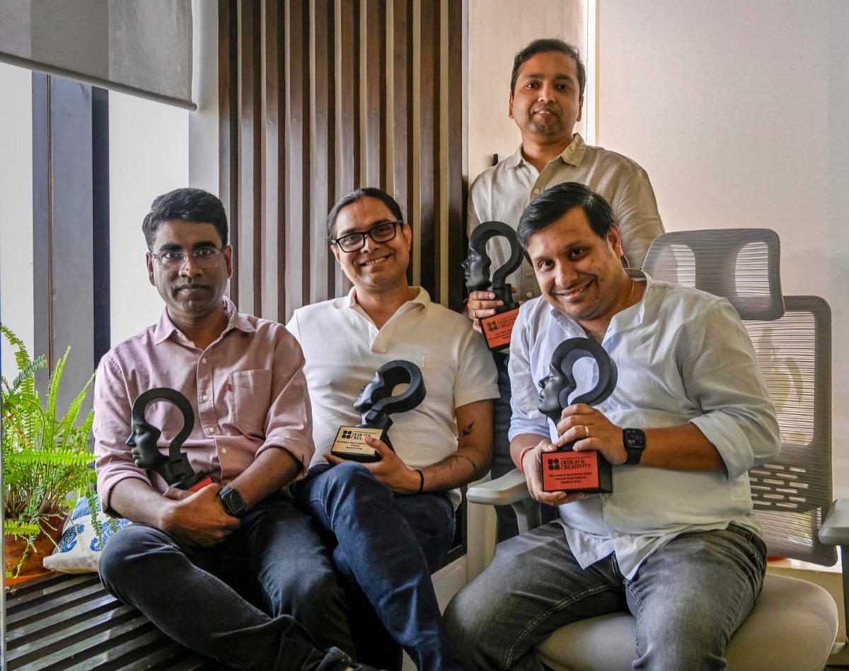 Mayabious Group leadership posing for a group photo with the awards