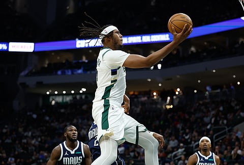 Milwaukee Bucks center Myles Turner (3) drives against the Dallas Mavericks during the first half of an NBA basketball game in Milwaukee. 