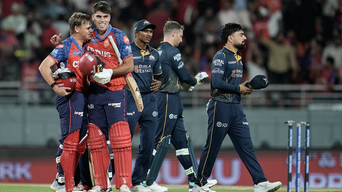 Punjab Kings' Cooper Connolly, left, and Xavier Bartlett celebrate after winning the Indian Premier League cricket match against Gujarat Titans in New Chandigarh, India, Tuesday, March 31, 2026 - (AP Photo/Ashwini Bhatia)