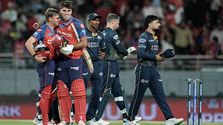 Punjab Kings' Cooper Connolly, left, and Xavier Bartlett celebrate after winning the Indian Premier League cricket match against Gujarat Titans in New Chandigarh, India, Tuesday, March 31, 2026 - (AP Photo/Ashwini Bhatia)