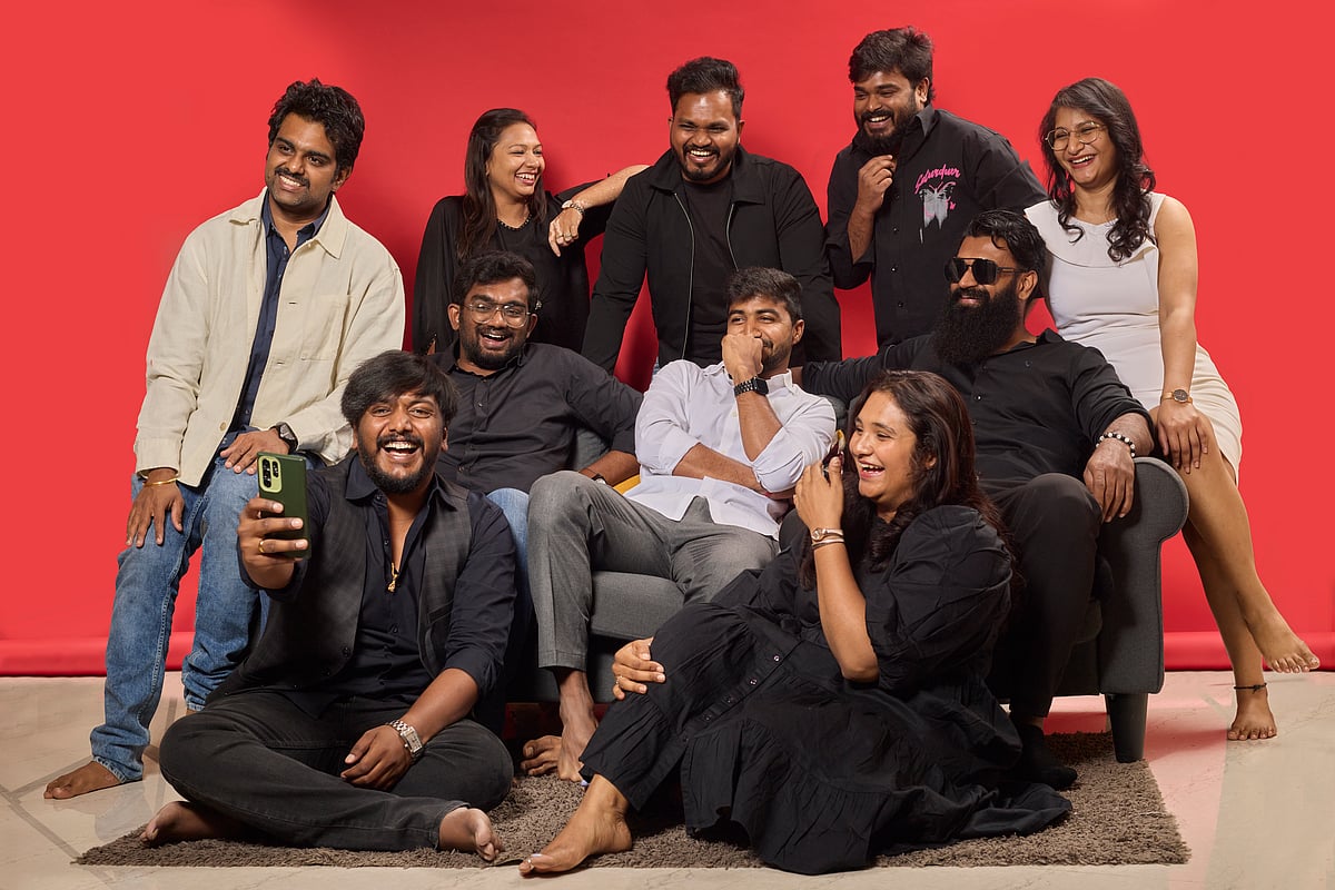 Group of friends laughing on a couch - null