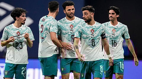 Portugal team mates celebrate a goal against the USA during the first half of an international friendly soccer match, Tuesday, March 31, 2026, in Atlanta.