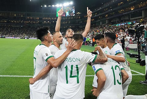 Bolivia's Moises Paniagua (13) is congratulated after scoring his side's first goal during the World Cup playoff final soccer match between Iraq and Bolivia in Monterrey, Mexico.