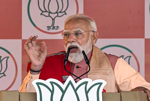 Prime Minister Narendra Modi addresses a gathering during a public meeting, in Gogamukh, Assam. 