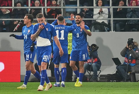 Serbia's Aleksandar Mitrovic, right, celebrates with teammates after scoring his side's second goal during the international friendly soccer match between Serbia and Saudi Arabia in Backa Topola, Serbia.
