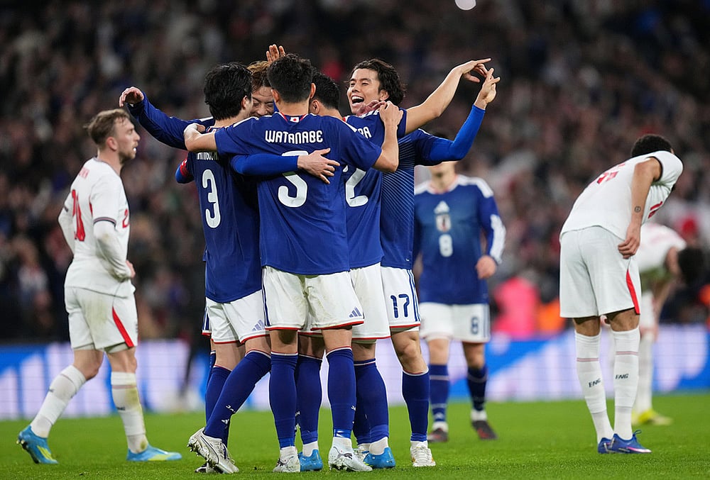 Japan players celebrate after winning the International friendly soccer match between England and Japan in London. - | Photo: AP/Kirsty Wigglesworth