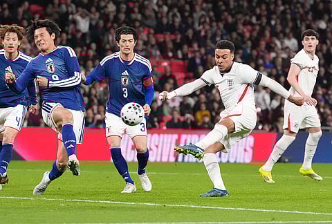 England's Morgan Rogers shoots at goal during the International friendly soccer match between England and Japan in London.