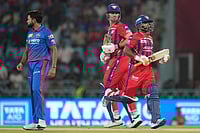 Photo: AP/Manish Swarup : Delhi Capitals' Mukesh Kumar, left, watches the ball as Lucknow Super Giants' captain Rishabh Pant, right, and batting partner Mitchell Marsh run between the wickets during the Indian Premier League cricket match between Lucknow Super Giants and Delhi Capitals in Lucknow, India.