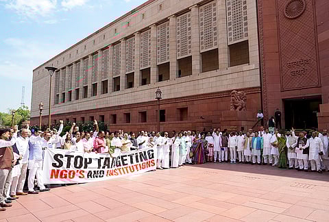Opposition MPs Hibi Eden, Prashant Padole, Dean Kuriakose, Supriya Sule, and others, stage a protest during the second part of the Budget session of Parliament, in New Delhi.