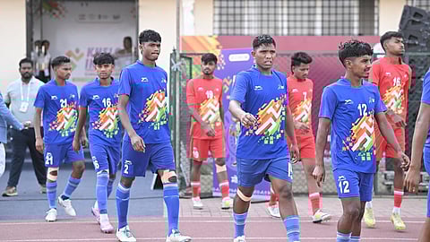 Teams walking out to the pitch for a football match at Khelo India Tribal Games.