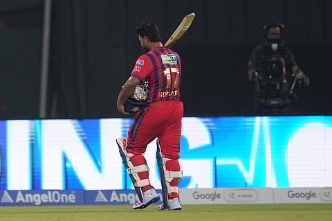 Lucknow Super Giants' captain Rishabh Pant walks off the field after losing his wicket during the Indian Premier League cricket match between Lucknow Super Giants and Delhi Capitals in Lucknow, India.