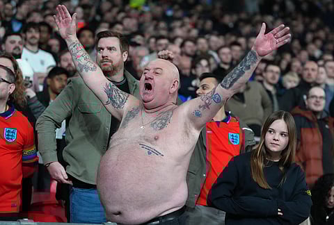England supporters cheer during the International friendly soccer match between England and Japan in London.