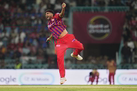 Lucknow Super Giants' Mohsin Khan celebrates the dismissal of Delhi Capitals' Nitish Rana during the Indian Premier League cricket match between Lucknow Super Giants and Delhi Capitals in Lucknow, India.