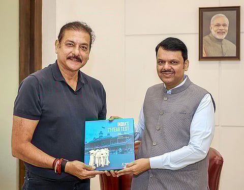 Maharashtra Chief Minister Devendra Fadnavis being presented a book ‘India's 71-Year Test: The Journey to Triumph in Australia’, written by P. Kaushik and R. Kaushik, as a memento by former cricketer and commentator Ravi Shastri during a meeting, at CM’s residence, in Mumbai. 
