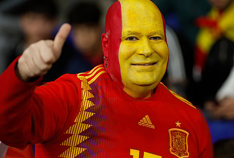 Spain's supporter cheers prior to the start of the international friendly soccer match between Spain and Egypt in Barcelona, Spain.