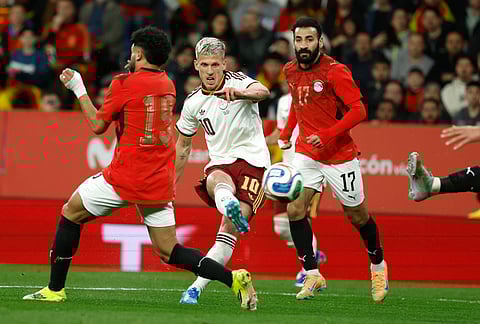 Spain's Dani Olmo, center, attempts a goal during the international friendly soccer match between Spain and Egypt in Barcelona, Spain.