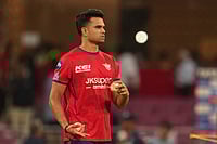 | Photo: AP/Manish Swarup : Lucknow Super Giants' Arjun Tendulkar warms up before the start of the Indian Premier League cricket match between Lucknow Super Giants and Delhi Capitals in Lucknow, India.