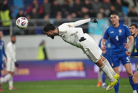 Saudi Arabia's Saleh Alshehri heads the ball during the international friendly soccer match between Serbia and Saudi Arabia in Backa Topola, Serbia.