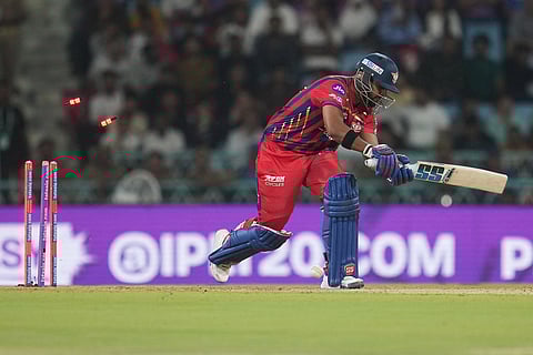 Lucknow Super Giants' Nicholas Pooran is bowled out by Delhi Capitals' Lungi Ngidi during the Indian Premier League cricket match between Lucknow Super Giants and Delhi Capitals in Lucknow, India.
