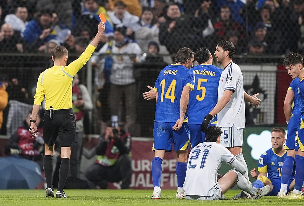 Bosnia vs Italy World Cup qualifying playoff final-Referee Clement Turpin shows a red card 