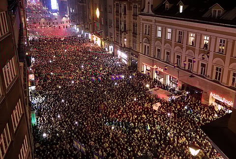 An aerial view shows fans celebrating after the Bosnian national team qualified for the World Cup by winning a penalty shootout against Italy, in Sarajevo, Bosnia.