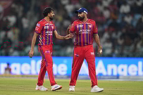 Lucknow Super Giants' Prince Yadav, left, speaks to teammate Mohammed Shami during the Indian Premier League cricket match between Lucknow Super Giants and Delhi Capitals in Lucknow, India.