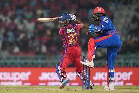 Lucknow Super Giants' Shahbaz Ahmed, left, bat during the Indian Premier League cricket match between Lucknow Super Giants and Delhi Capitals in Lucknow, India.