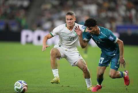 Bolivia's Lucas Macazaga, left, and Iraq's Ali Jasim vie for the ball during the World Cup playoff final soccer match between Iraq and Bolivia in Monterrey, Mexico.