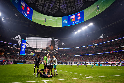 USA's Weston McKennie (8) lies injured against Portugal during the first half of an international friendly soccer match, in Atlanta. 