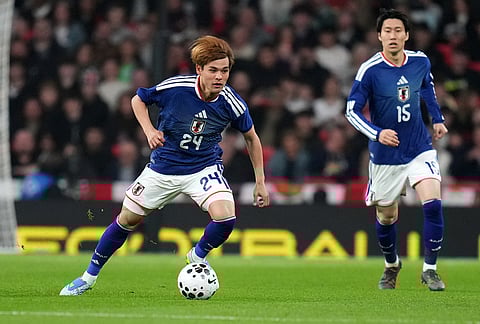 Japan's Kaishu Sano controls the ball during the International friendly soccer match between England and Japan in London.