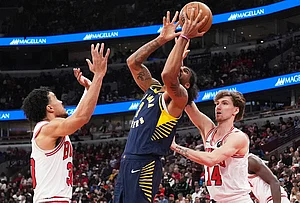 | Photo: AP/Nam Y. Huh : Indiana Pacers forward Obi Toppin, center, drives to the basket against Chicago Bulls guard Tre Jones, left, and forward Matas Buzelis during the second half of an NBA basketball game in Chicago.