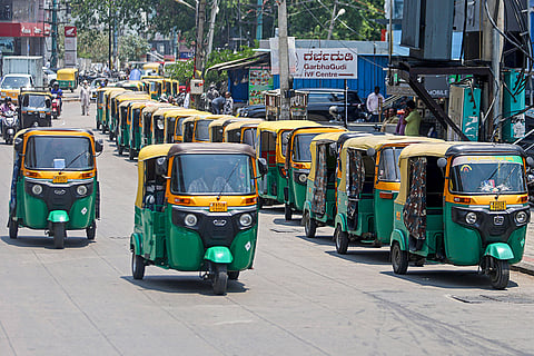Autorickshaws queue up near a fuel station amid LPG and petrol price hike, in Bengaluru.