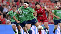 (Dave Hunt/AAP Image via AP) : Highlanders player Shane Christie, center, gets into space during the Round 16 Super Rugby match between the Queensland Reds and the Highlanders at Suncorp Stadium in Brisbane, Australia on May 30, 2014.