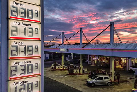 The sun has set behind a gas station in Frankfurt, Germany, Tuesday, March 31, 2026. 