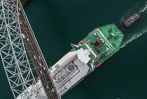 A liquefied natural gas carrier sails under Las Americas Bridge through the Panama Canal in Panama City, Tuesday, March 24, 2026.